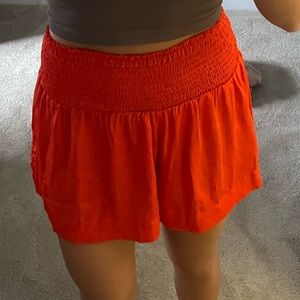 Pants Store Smocked High Rise Shorts in Coral